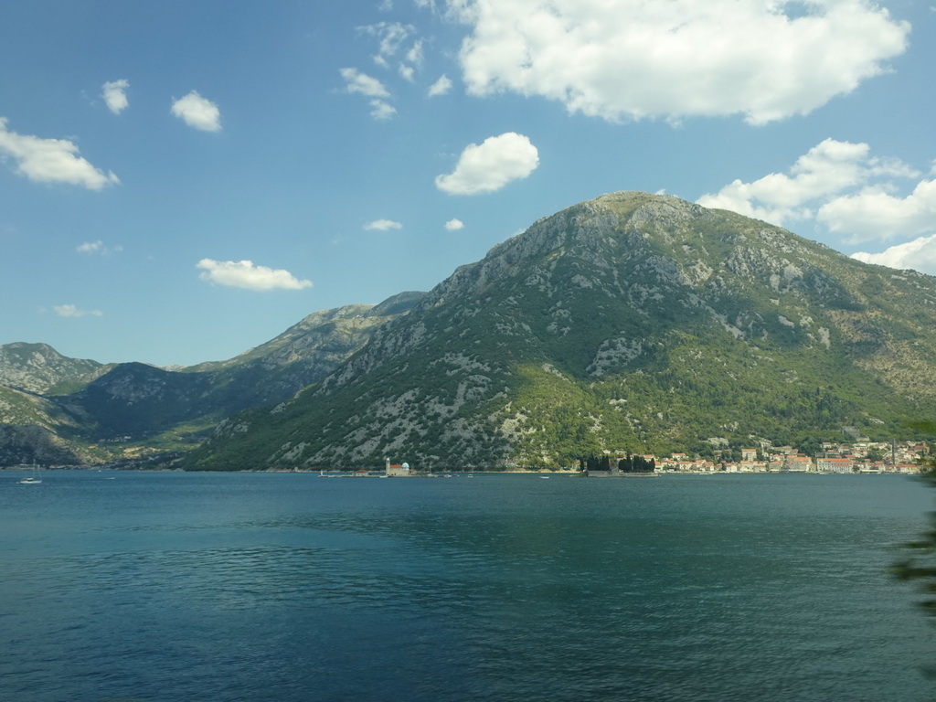 The Bay of Kotor with the Our Lady of the Rocks Island and the Saint George Island, viewed from the tour bus on the E65 road just east of the town of Kostanjica