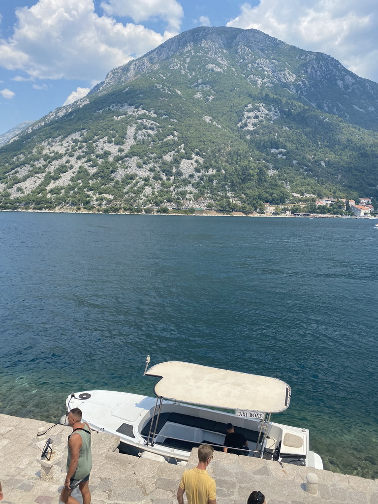 Boat at the Bay of Kotor and the west side of the town, viewed from the roof terrace of the Church of Our Lady of the Rocks at the Our Lady of the Rocks Island