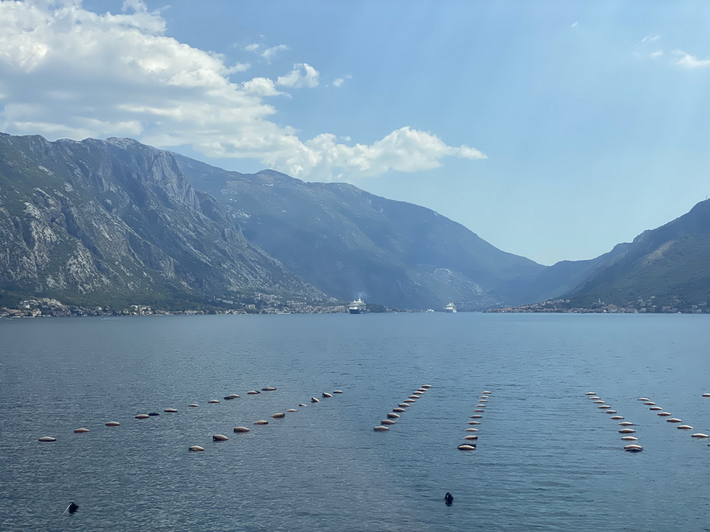 Boats at the Bay of Kotor and the towns of Donji Stoliv and Prcanj, viewed from the tour bus on the E65 road at the town of Drain Vrt