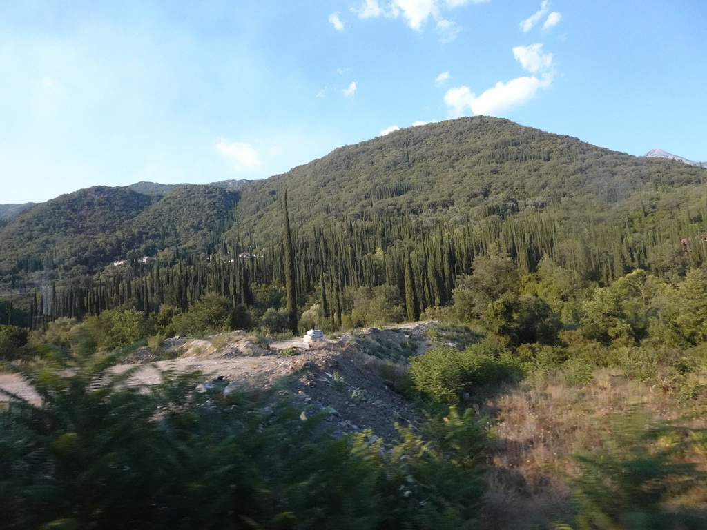 Hills and trees just northwest of the town of Igalo, viewed from the tour bus on the E65 road