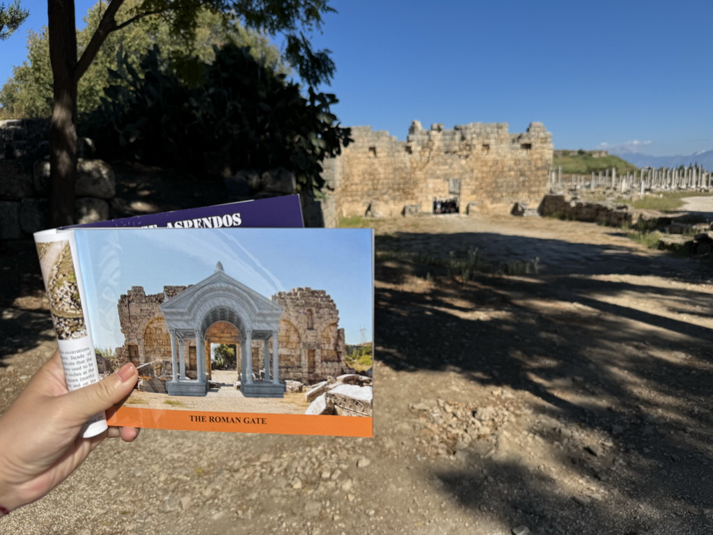 South side of the Roman Gate at the south side of the City Walls at the Ancient City of Perge, with a reconstruction in a travel guide