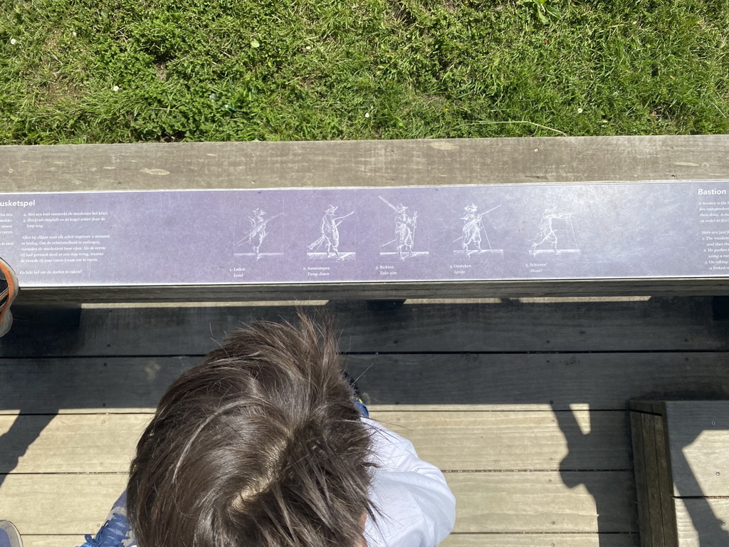 Max with the instructions for the musket shooting game at Loevestein Castle