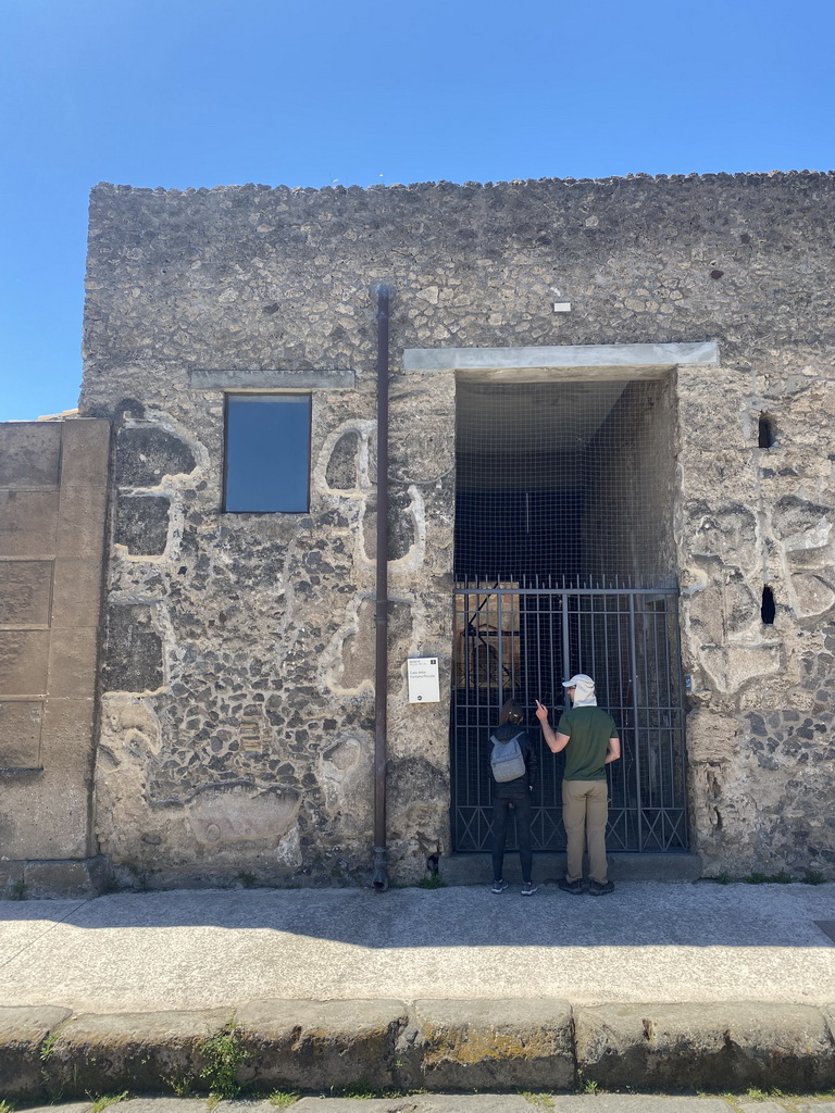 Front of the House of the Small Fountain at the Via di Mercurio street at the Pompeii Archeological Site, with explanation