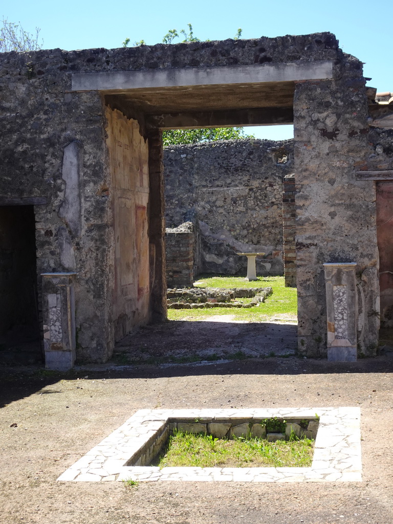 Walls and altar at the House of Apollo at the Pompeii Archeological Site, viewed from the Via di Mercurio street