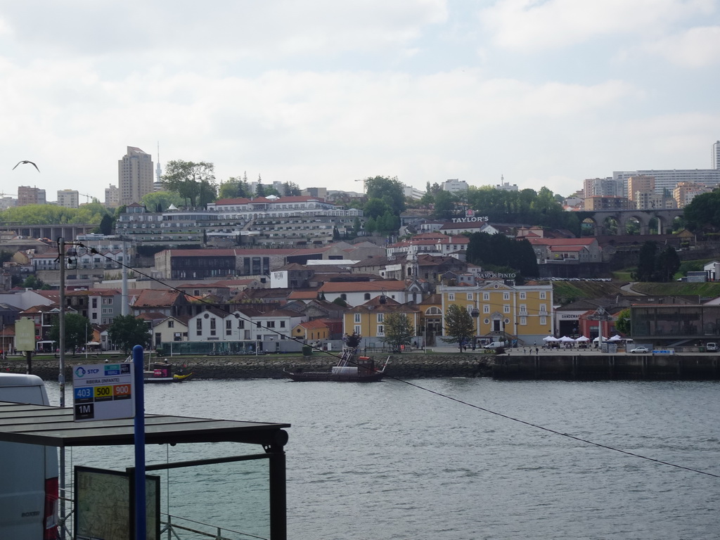 Boats on the Douro river and Vila Nova de Gaia, viewed from the sightseeing bus on the Rua Nova da Alfândega street