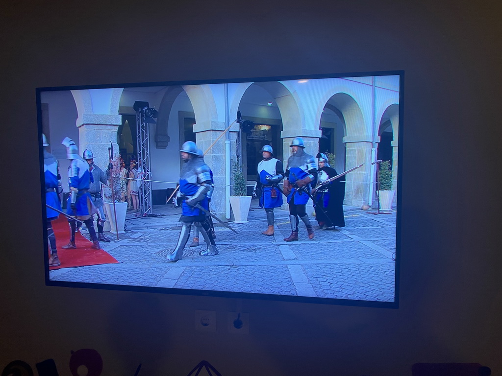 TV screen with images from the opening in 2014 at the hallway of the World of Discoveries museum