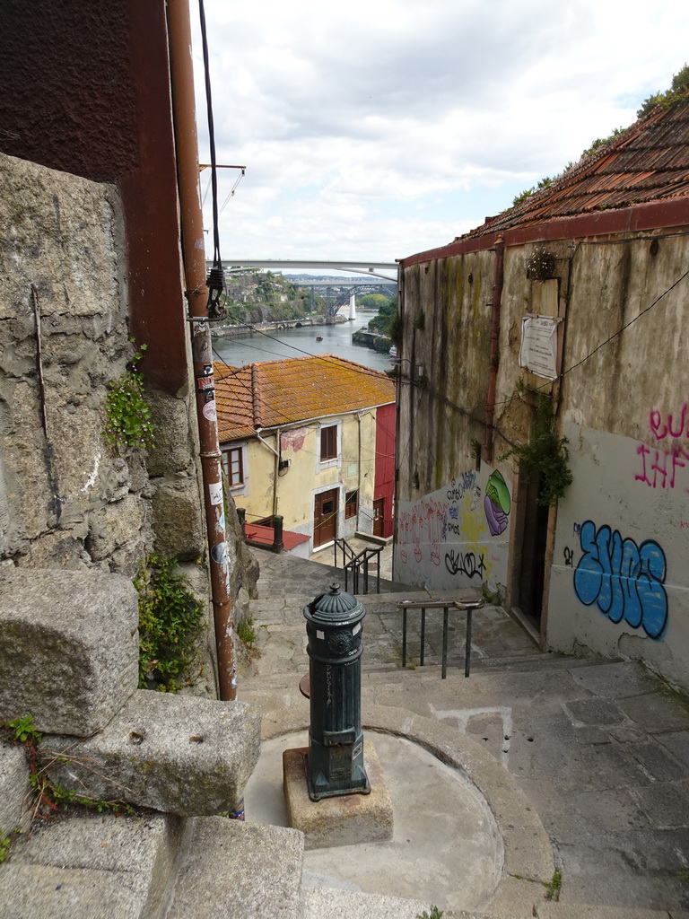 Fountain at the Escada dos Guindais staircase, with a view on the Ponte Infante Dom Henrique, the Ponte de São João and the Ponte D. Maria Pia bridges over the Douro river