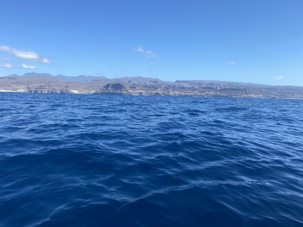 The coastline, viewed from a small boat from the Sagitarius Cat boat to the jet ski