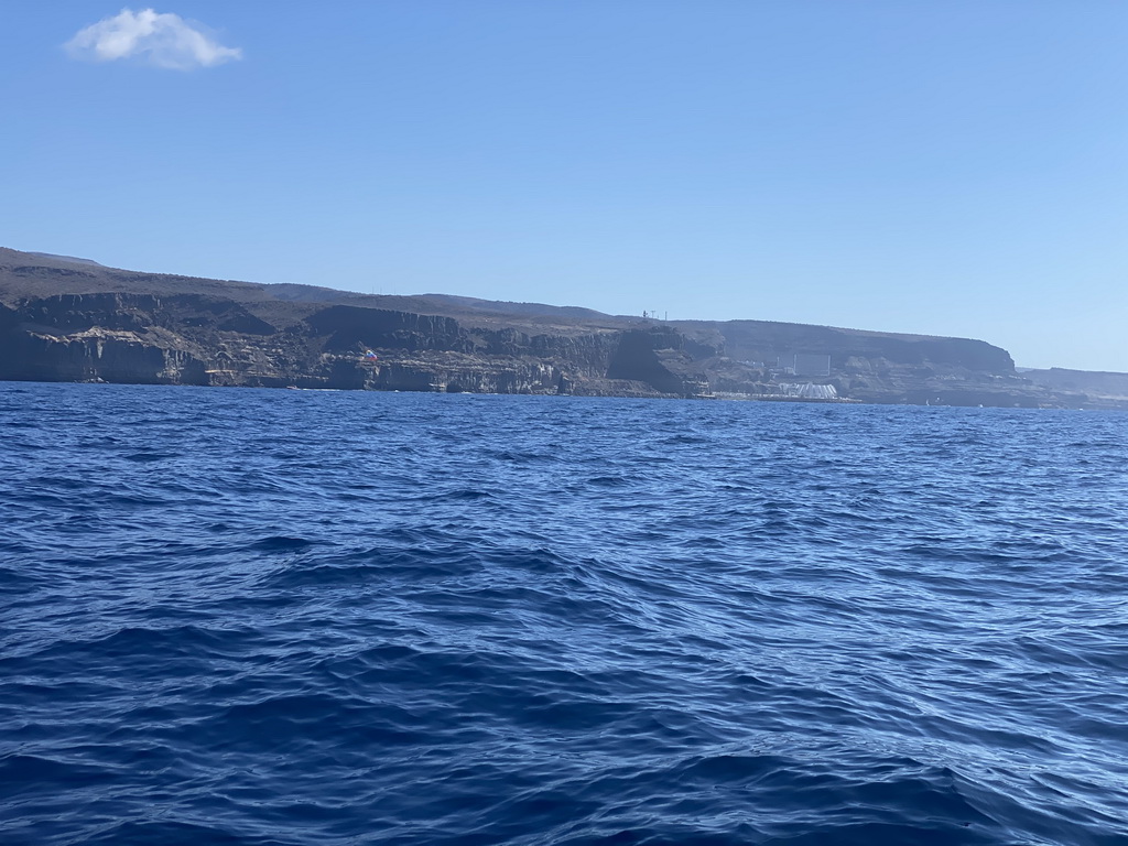 Parasail in front of the coastline, viewed from a small boat from the jet ski to the Sagitarius Cat boat