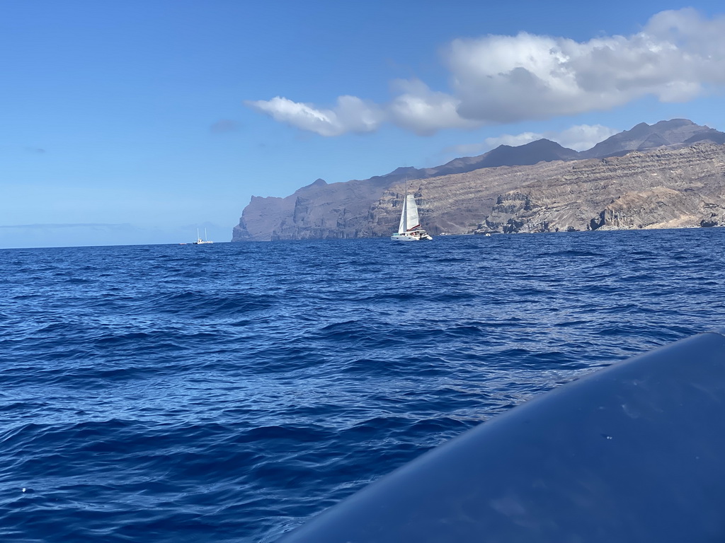 Boats in front of the coastline, viewed from a small boat from the jet ski to the Sagitarius Cat boat