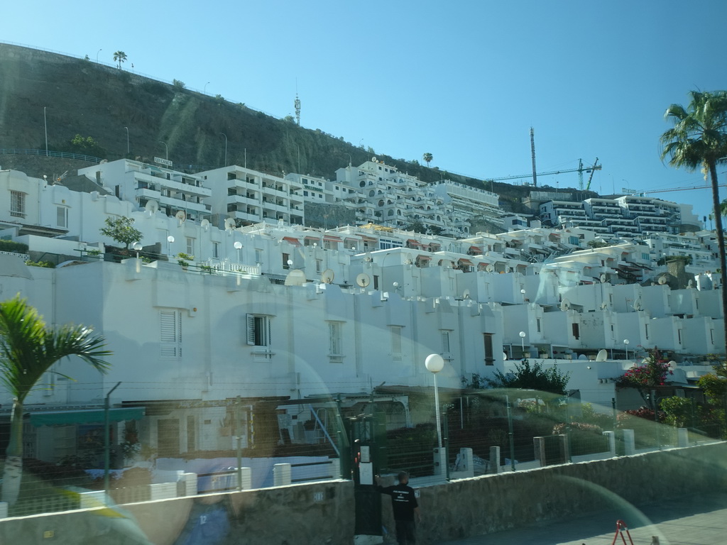 Houses at the Avenida Tomás Roca Bosch street, viewed from the tour bus bus from Maspalomas