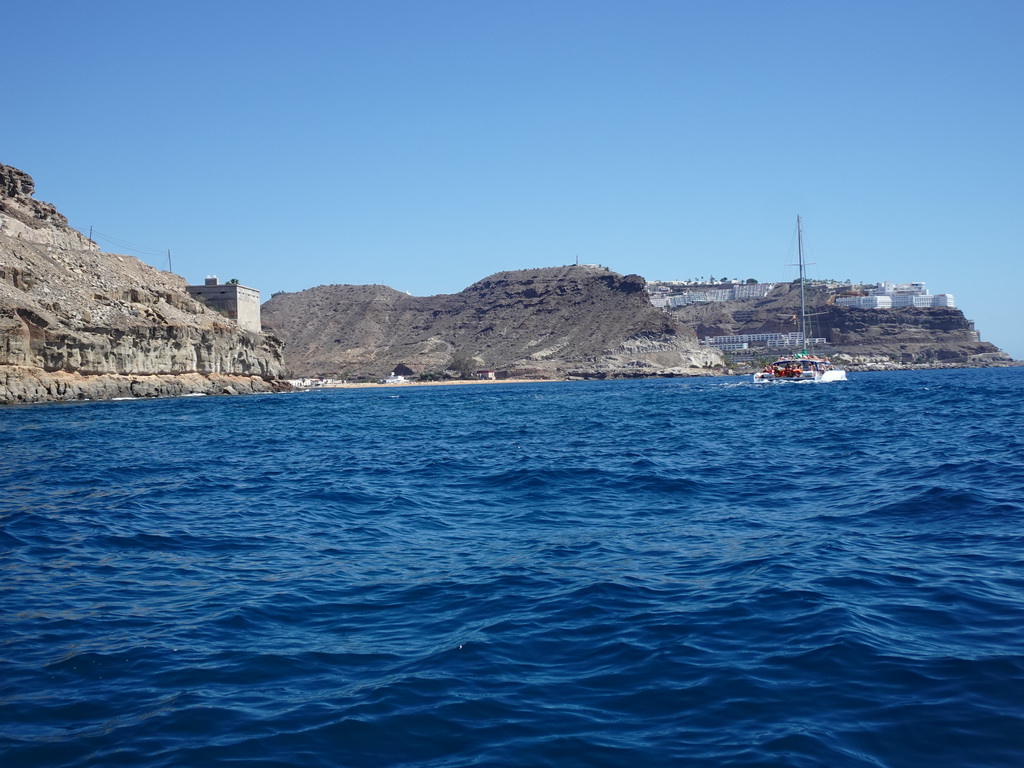 Boat in front of the Playa de Tauro beach, viewed from the Sagitarius Cat boat