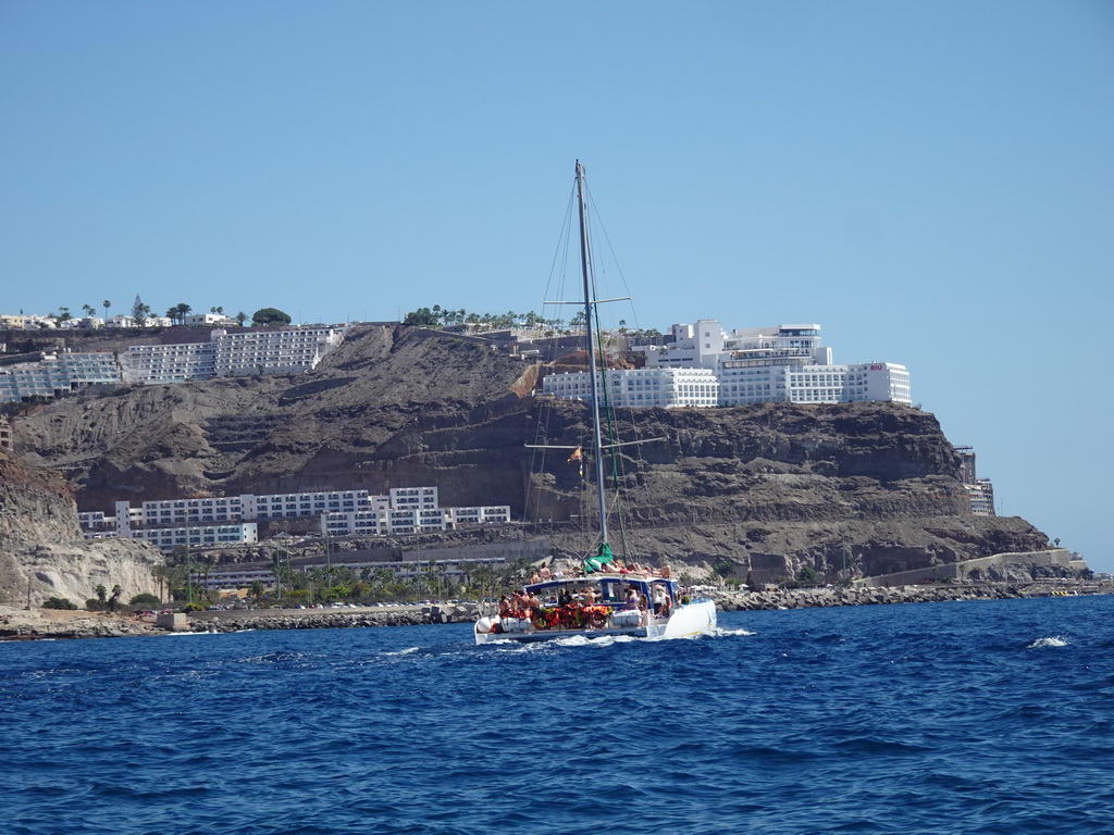 Boat in front of the Playa de Tauro beach, viewed from the Sagitarius Cat boat