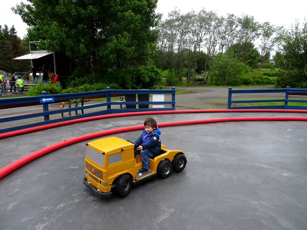 Max in a bumper truck at the Fjölskyldugarðurinn park