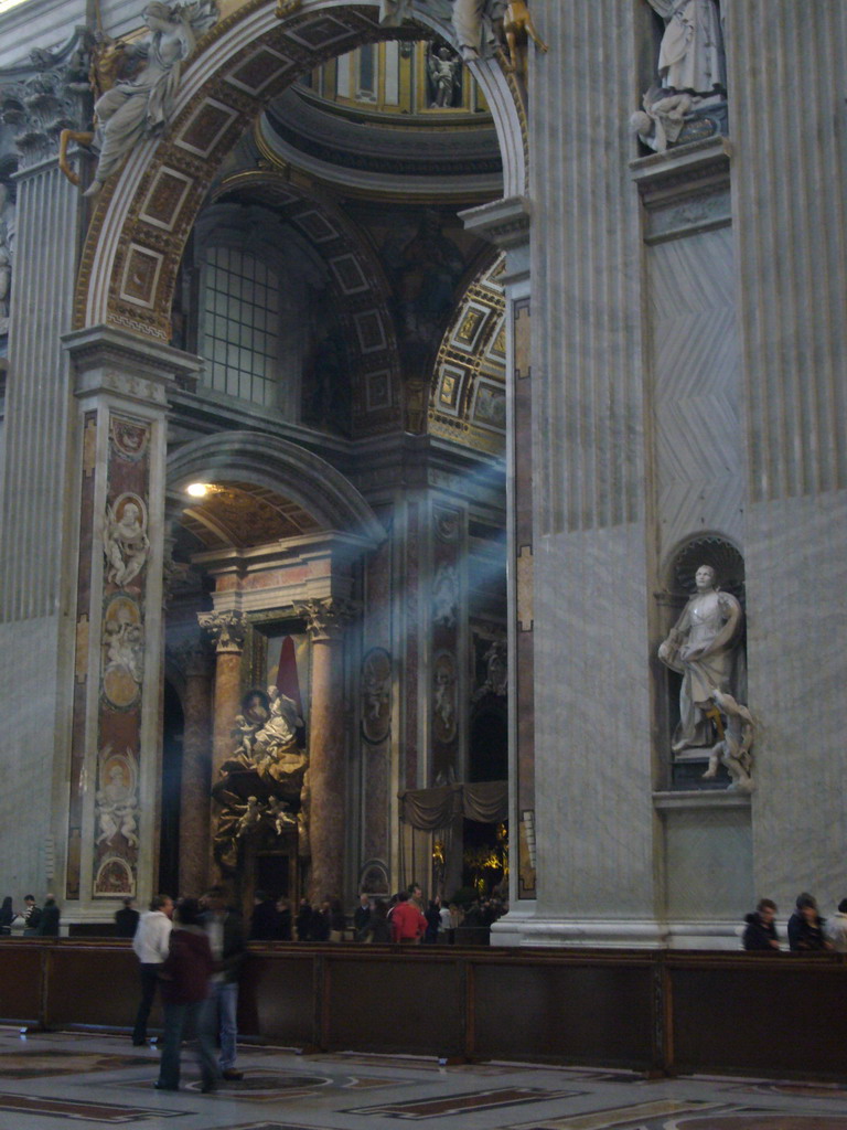 The nave of St. Peter`s Basilica, with the statue of St. Camillo de Lellis and the Monument of Pope Benedict XV