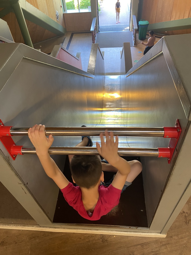 Max on a slide at the Huis in de Heuvel building at the Speelwijck area of the Plaswijckpark recreation park