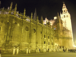 The east side of the Seville Cathedral with the Giralda tower at the Plaza del Triunfo square, by night