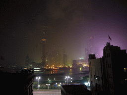 Skyline of the Pudong district, with the Oriental Pearl Tower, the Jin Mao Tower and the Shanghai World Financial Center (under construction), viewed from the roof of the Ambassador Hotel, by night