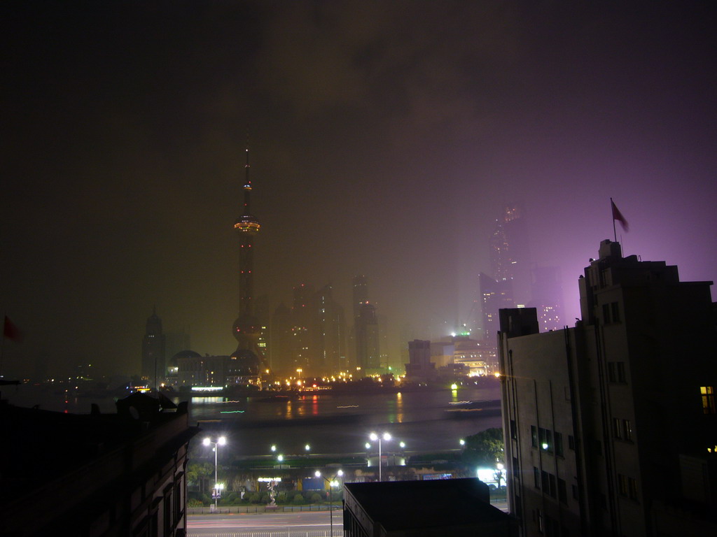 Skyline of the Pudong district, with the Oriental Pearl Tower, the Jin Mao Tower and the Shanghai World Financial Center (under construction), viewed from the roof of the Ambassador Hotel, by night