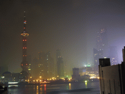 Skyline of the Pudong district, with the Oriental Pearl Tower, the Jin Mao Tower and the Shanghai World Financial Center (under construction), viewed from the roof of the Ambassador Hotel, by night