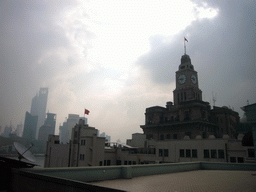 The Shanghai Customs House and the skyline of the Pudong district, with the Jin Mao Tower and the Shanghai World Financial Center (under construction), viewed from the roof of the Ambassador Hotel