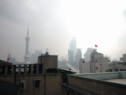 Skyline of the Pudong district, with the Oriental Pearl Tower, the Jin Mao Tower and the Shanghai World Financial Center (under construction), viewed from the roof of the Ambassador Hotel, by night