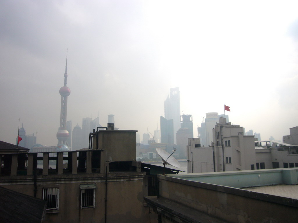 Skyline of the Pudong district, with the Oriental Pearl Tower, the Jin Mao Tower and the Shanghai World Financial Center (under construction), viewed from the roof of the Ambassador Hotel, by night