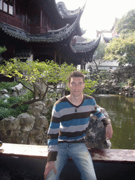 Tim with pavilions and pool in the Yuyuan Garden in the Old Town