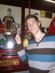 Tim with a statue in the Temple of the Town Gods in the Old Town