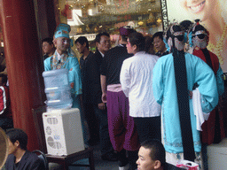 People performing a Chinese Opera at the shopping area just outside of the Temple of the Town Gods