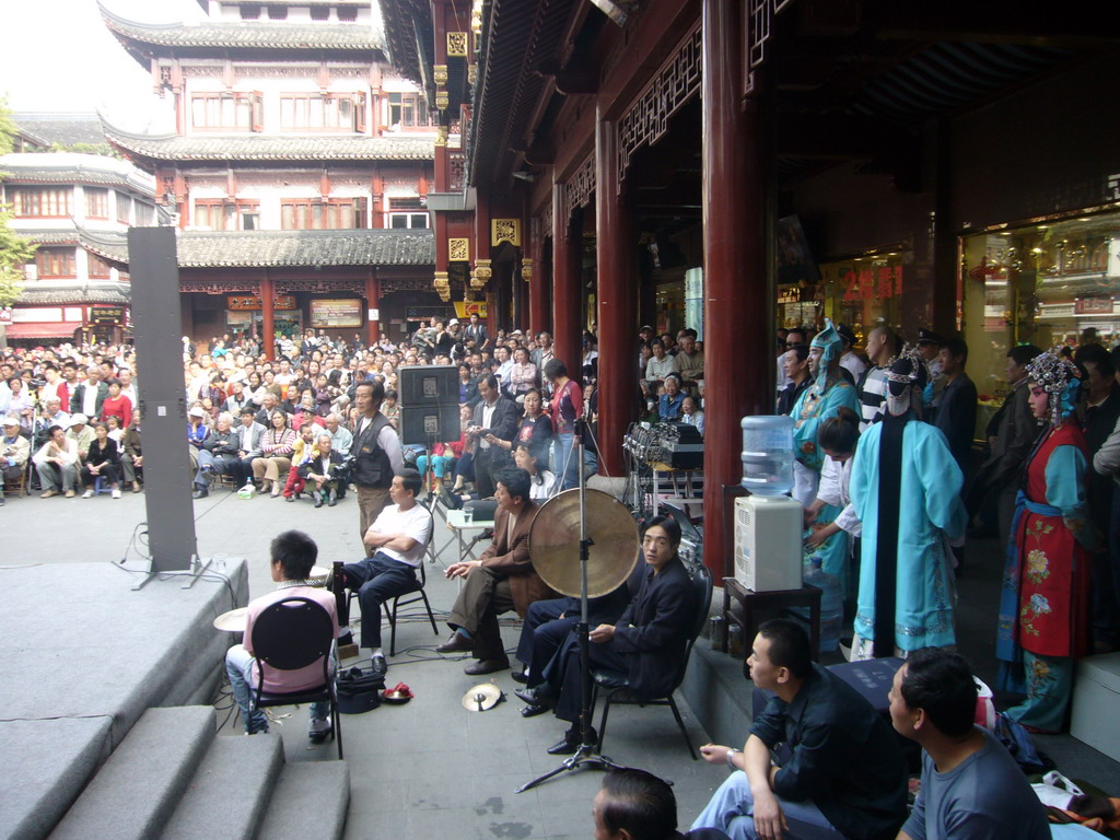 People performing a Chinese Opera at the shopping area just outside of the Temple of the Town Gods