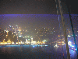 View on the Puxi skyline and the Bund area, with the Monument to the People`s Heroes at Huangpu Park, Tomorrow Square, Le Royal Méridien Shanghai and other skyscrapers, from the top of the Oriental Pearl Tower, by night