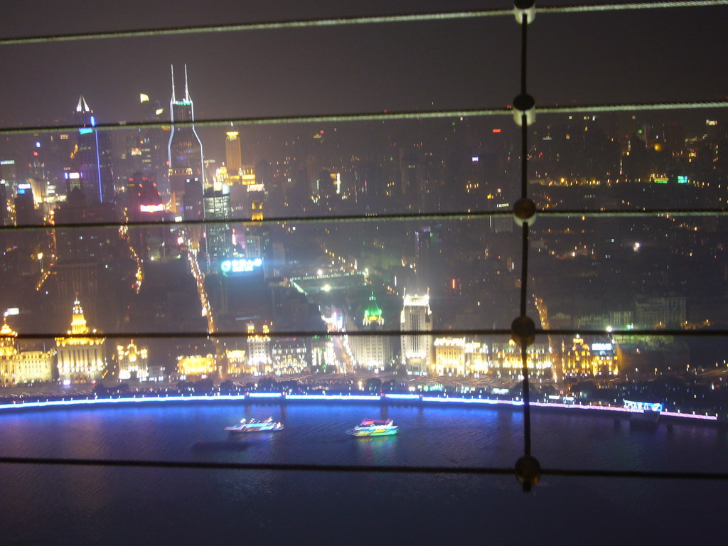 View on the Puxi skyline and the Bund area, with Tomorrow Square, Le Royal Méridien Shanghai and other skyscrapers, from the top of the Oriental Pearl Tower, by night