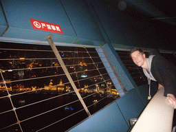 Tim at the top of the Oriental Pearl Tower, with a view on the Puxi skyline and the Bund area, with the Bund Center, Tomorrow Square and Le Royal Méridien Shanghai, by night