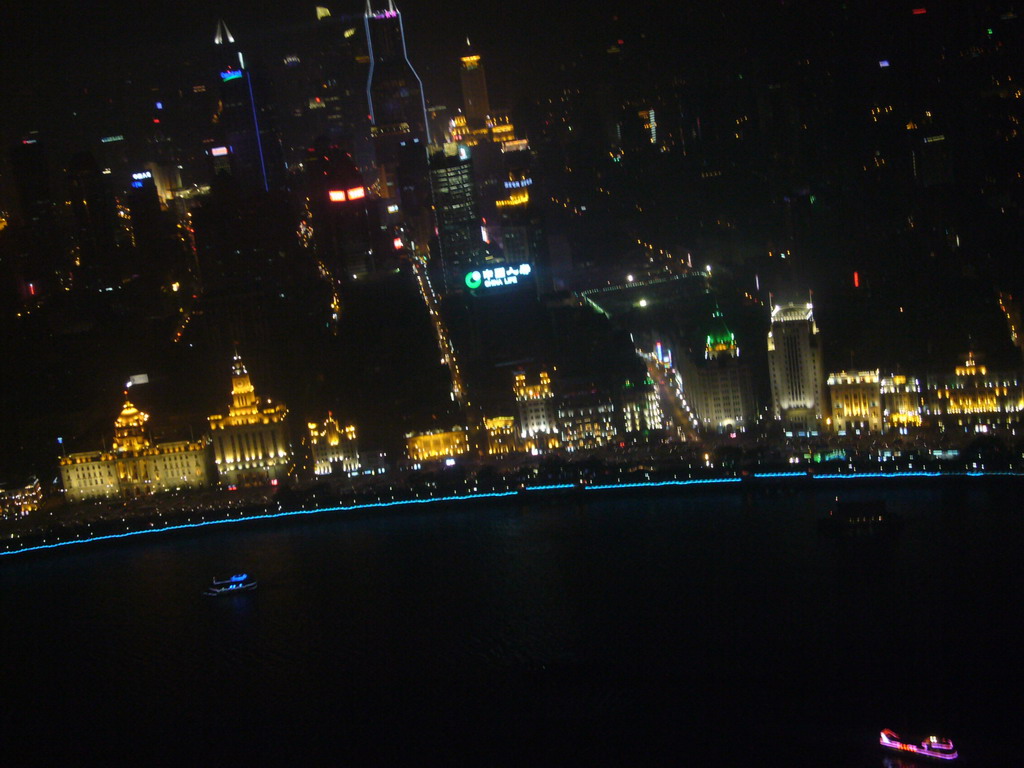 View on the Puxi skyline and the Bund area, with Tomorrow Square, Le Royal Méridien Shanghai and other skyscrapers, from the top of the Oriental Pearl Tower, by night