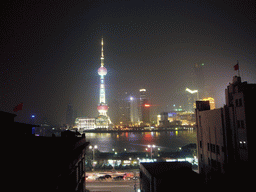 Skyline of the Pudong district, with the Oriental Pearl Tower, the Jin Mao Tower and the Shanghai World Financial Center (under construction), viewed from the roof of the Ambassador Hotel, by night