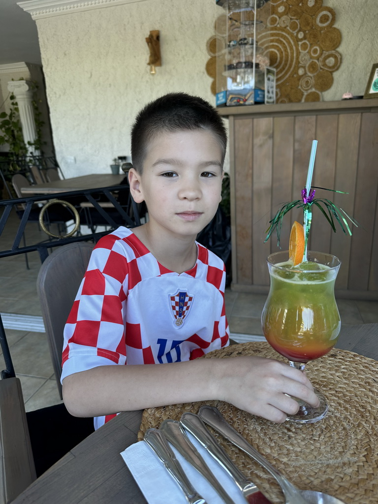 Max with a mocktail at Conny`s Restaurant