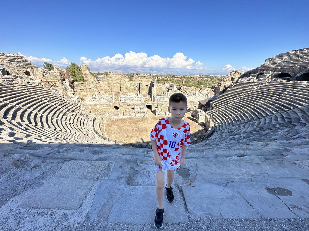 Max at the diazoma of the southwest auditorium of the Roman Theatre of Side, with a view on the auditorium, orchestra, stage and stage building