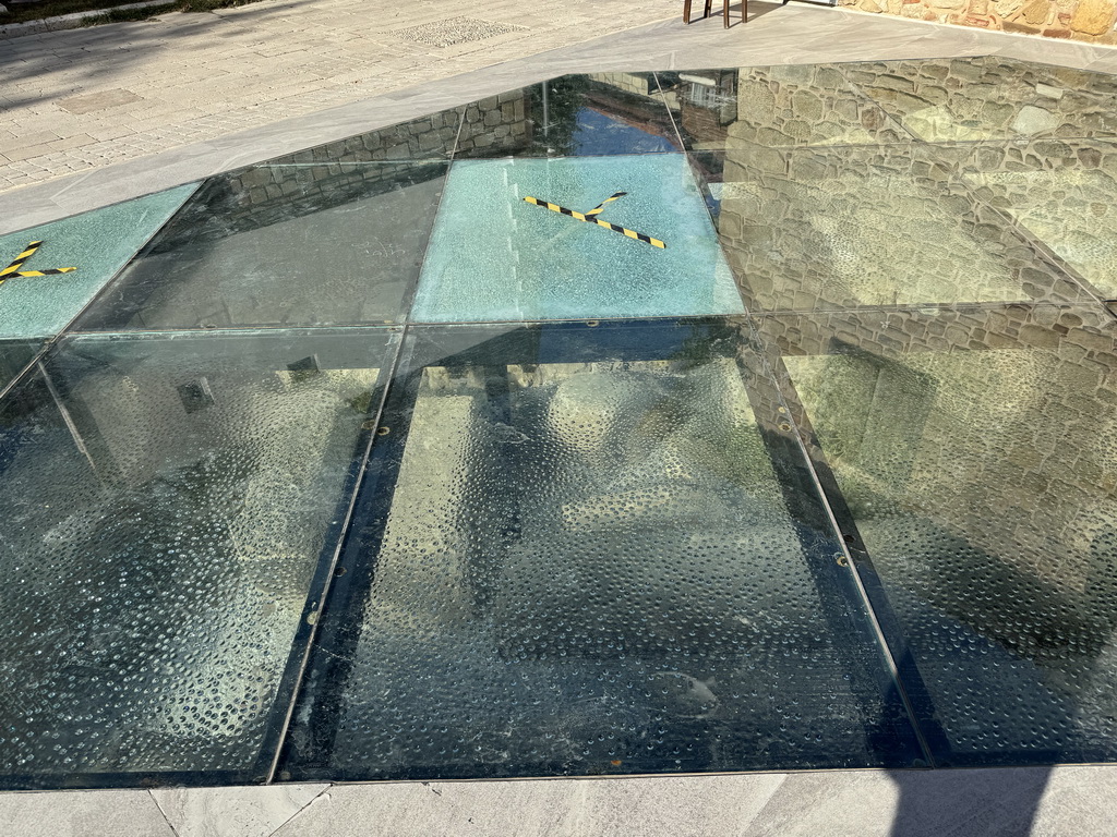 Glass floors with ruins underneath at the Turgut Reis Caddesi street