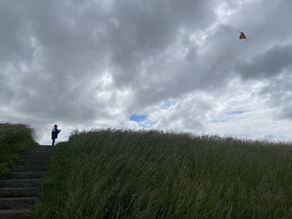 Max flying a kite at the dyke near the Dijkweg road