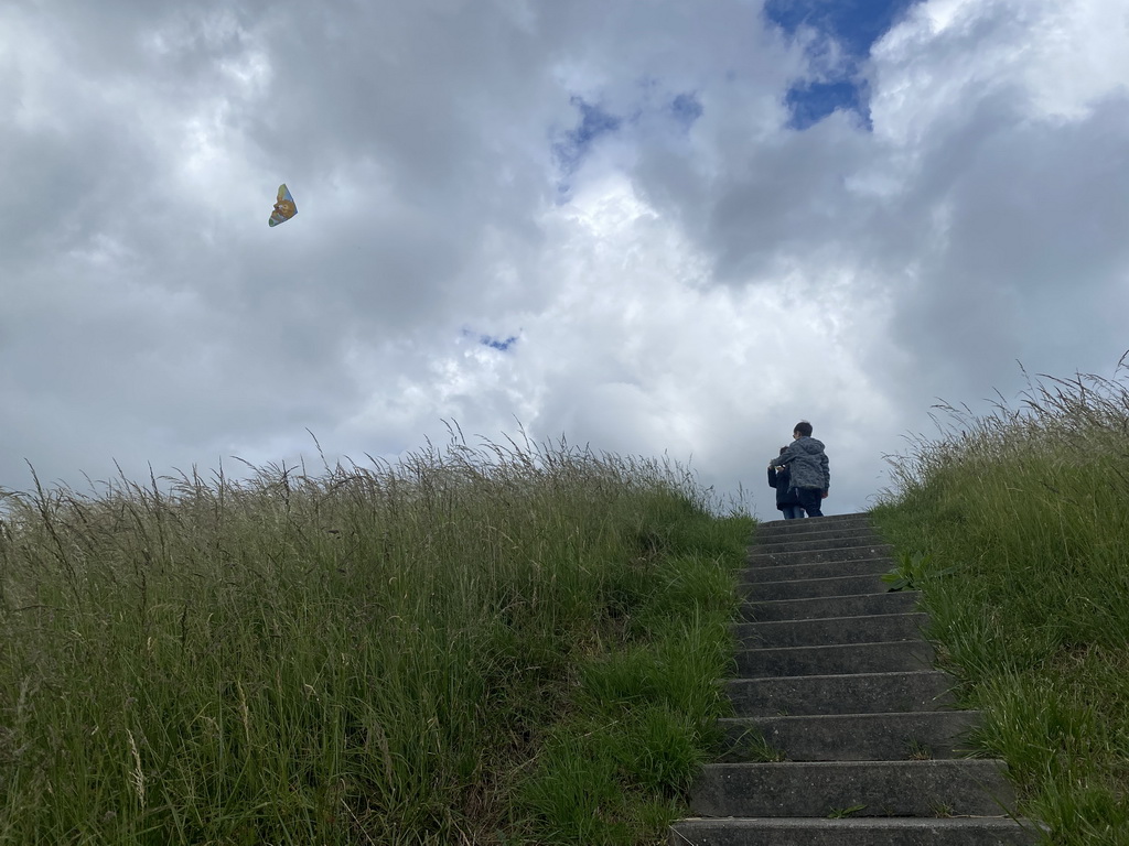 Max and our friend flying a kite at the dyke near the Dijkweg road