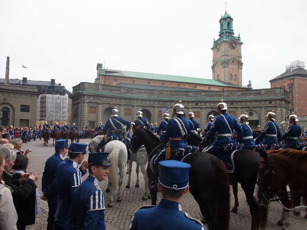 Changing of the guards, at the Outer Court of the Stockholm Palace, and the tower of the Saint Nicolaus Church