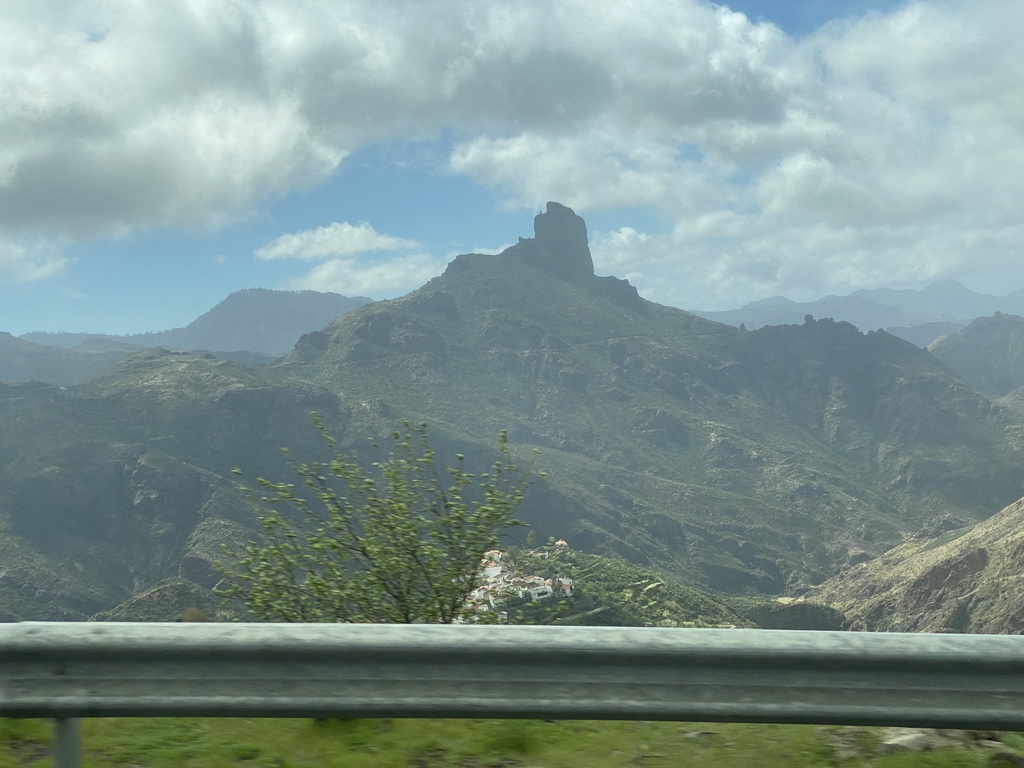 The Roque Bentayga rock and the north side of the town, viewed from the tour bus on the GC-15 road