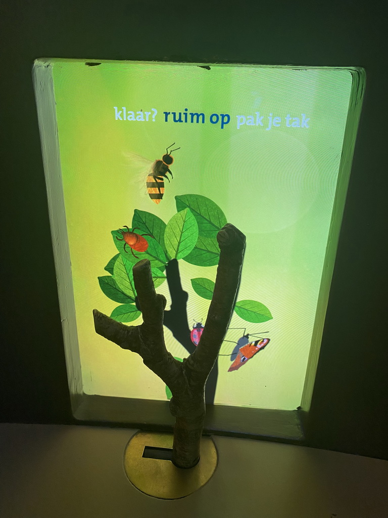 Wooden branch and screen at the `Beleef Ontdek Samen: BOS` exhibition at the second floor of the Natuurmuseum Brabant