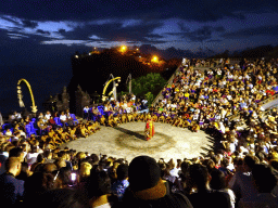 The Amphitheatre of the Pura Luhur Uluwatu temple, with a Giant during Act 4 of the Kecak and Fire Dance, by night