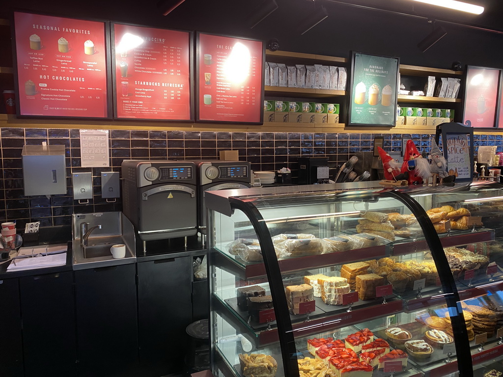 Menu and food at the Starbucks store at the Departure Hall of Eindhoven Airport