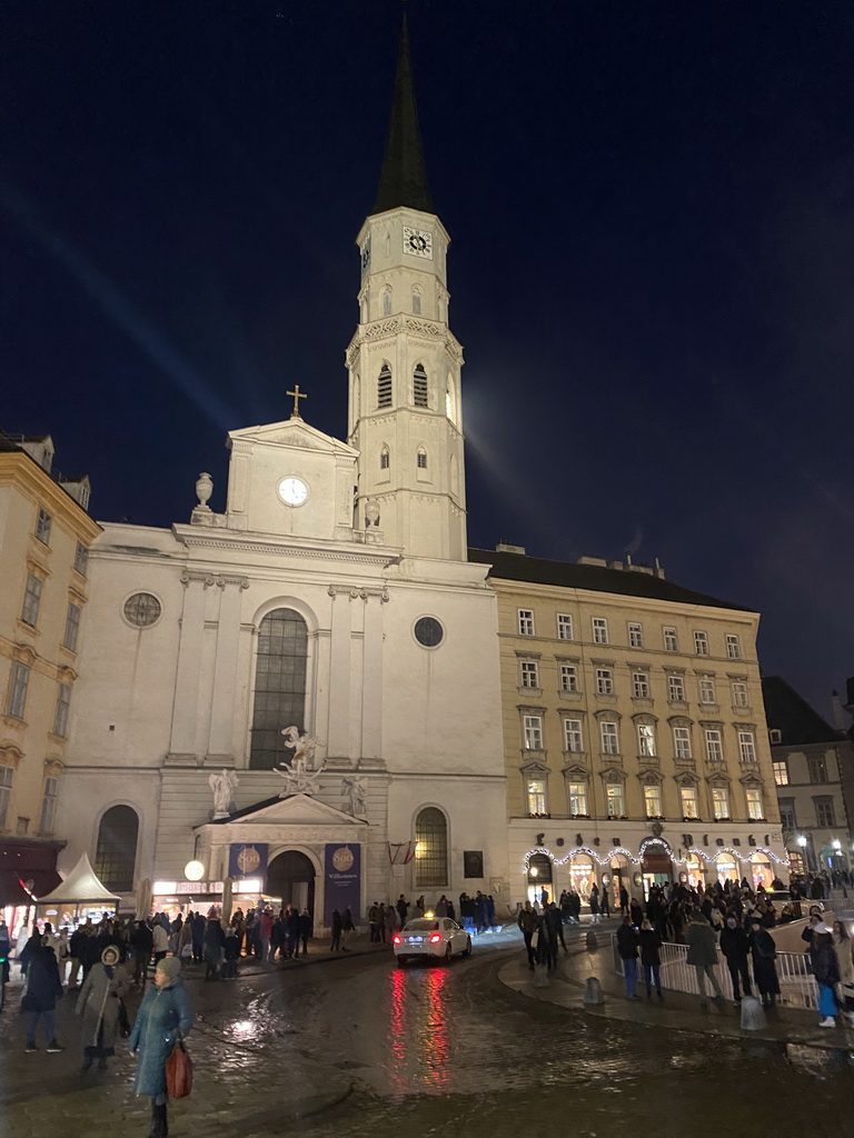 Front of St. Michael`s Church at the Michaelerplatz square, by night