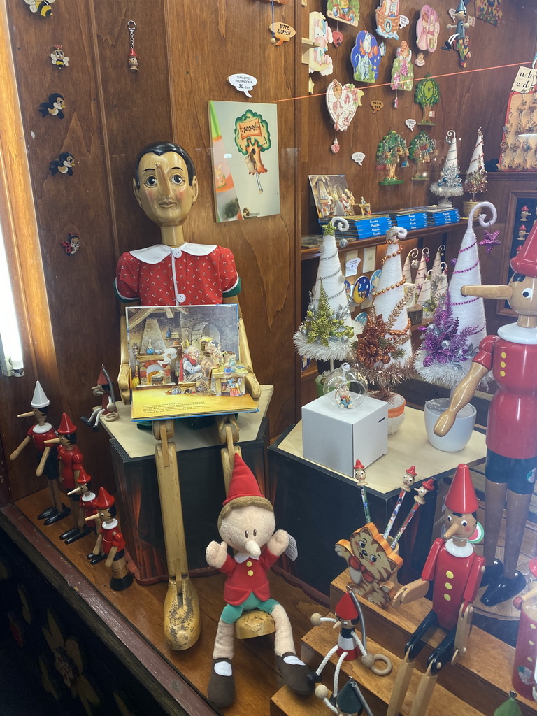 Toys in the window of the Pinocchio shop at the Augustinerstraße street, by night