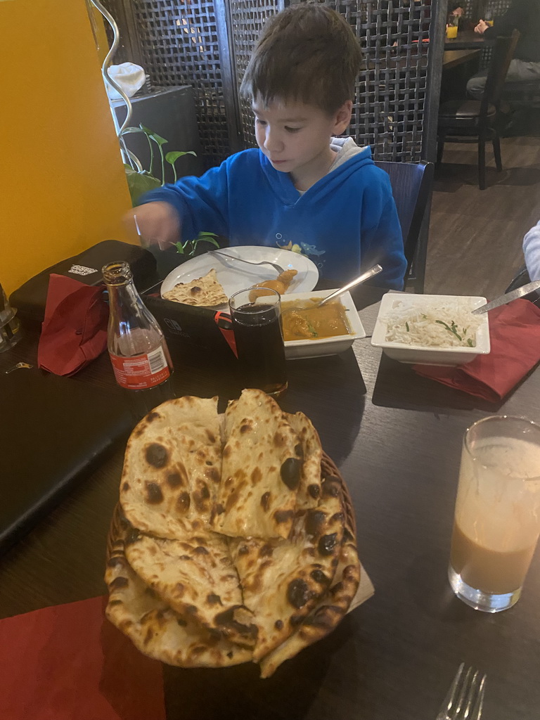 Max eating curry at the Spice of India restaurant