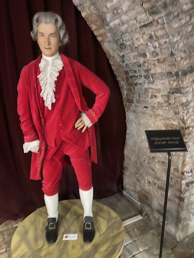 Statue of Wolfgang Amadeus Mozart at the `Music in Vienna` section at the Time Travel Vienna museum, with explanation